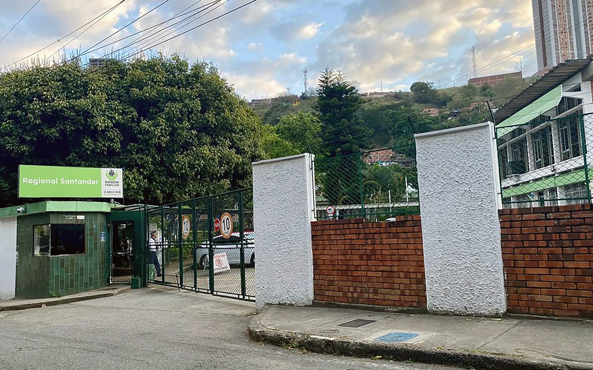 Blue digital watch on a dark liver background.